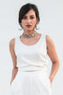 Model wearing a white crop top by Gulaal.